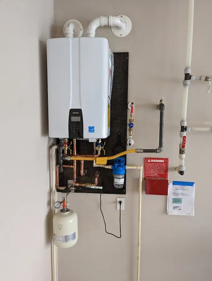 Professional plumber installing copper piping in a Poplar Bluff home